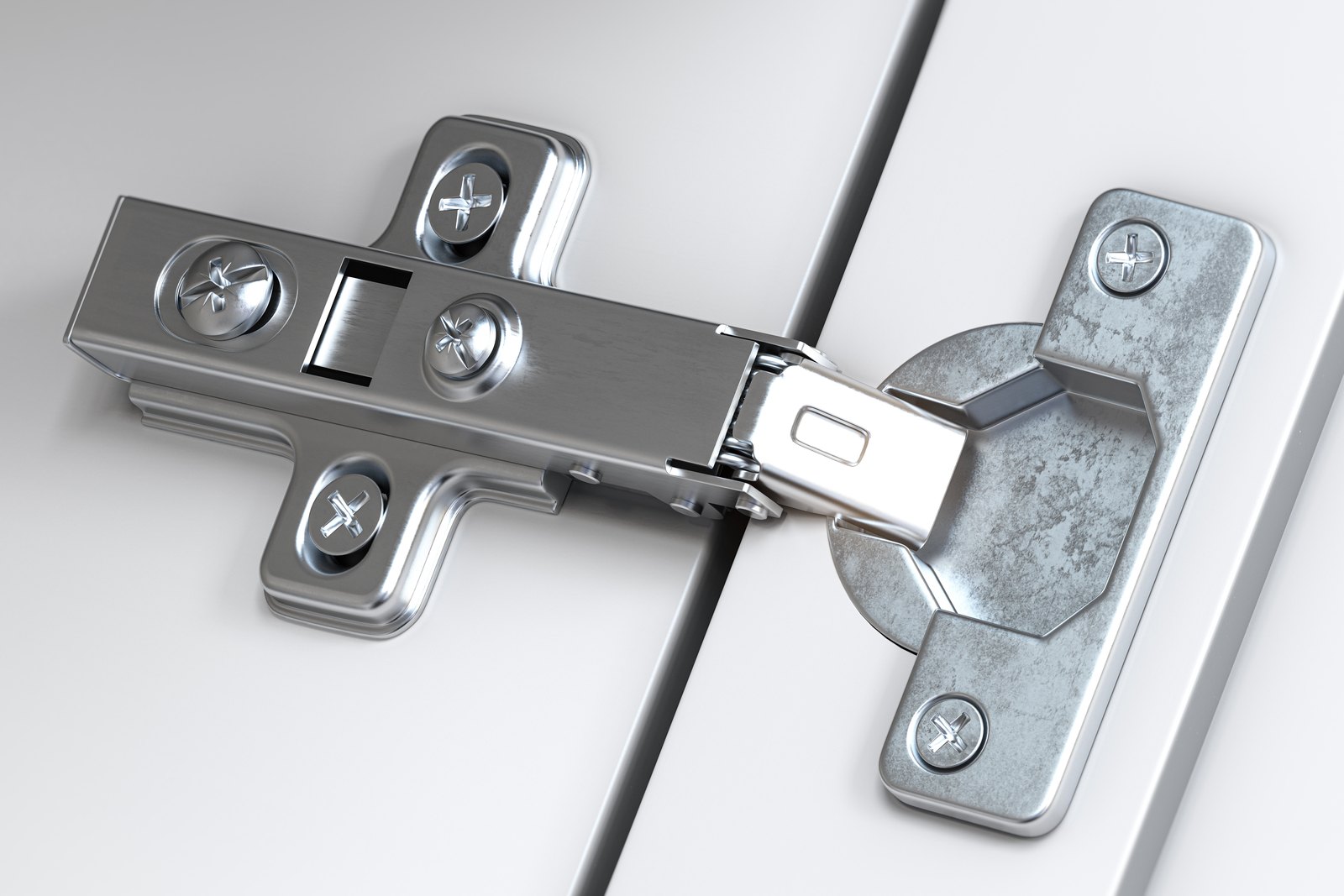Soft close cabinet hinge mounted on a white cabinet door
