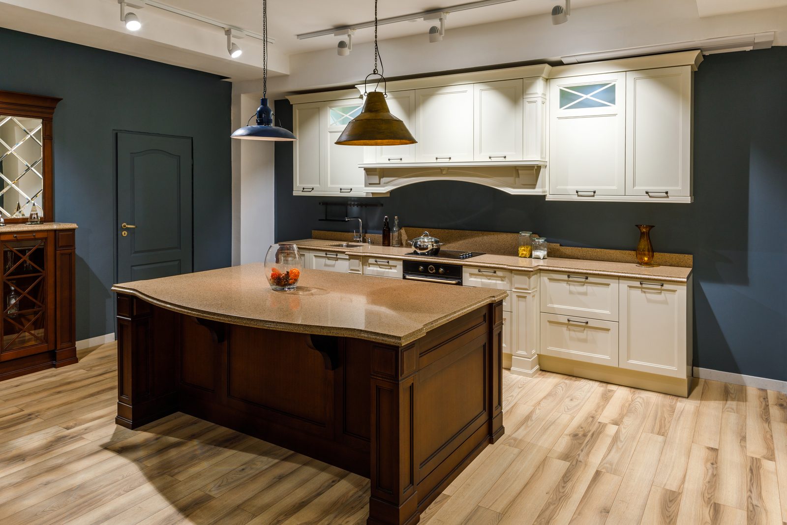 Traditional kitchen with a solid timber island, cream cabinets and a wood floor