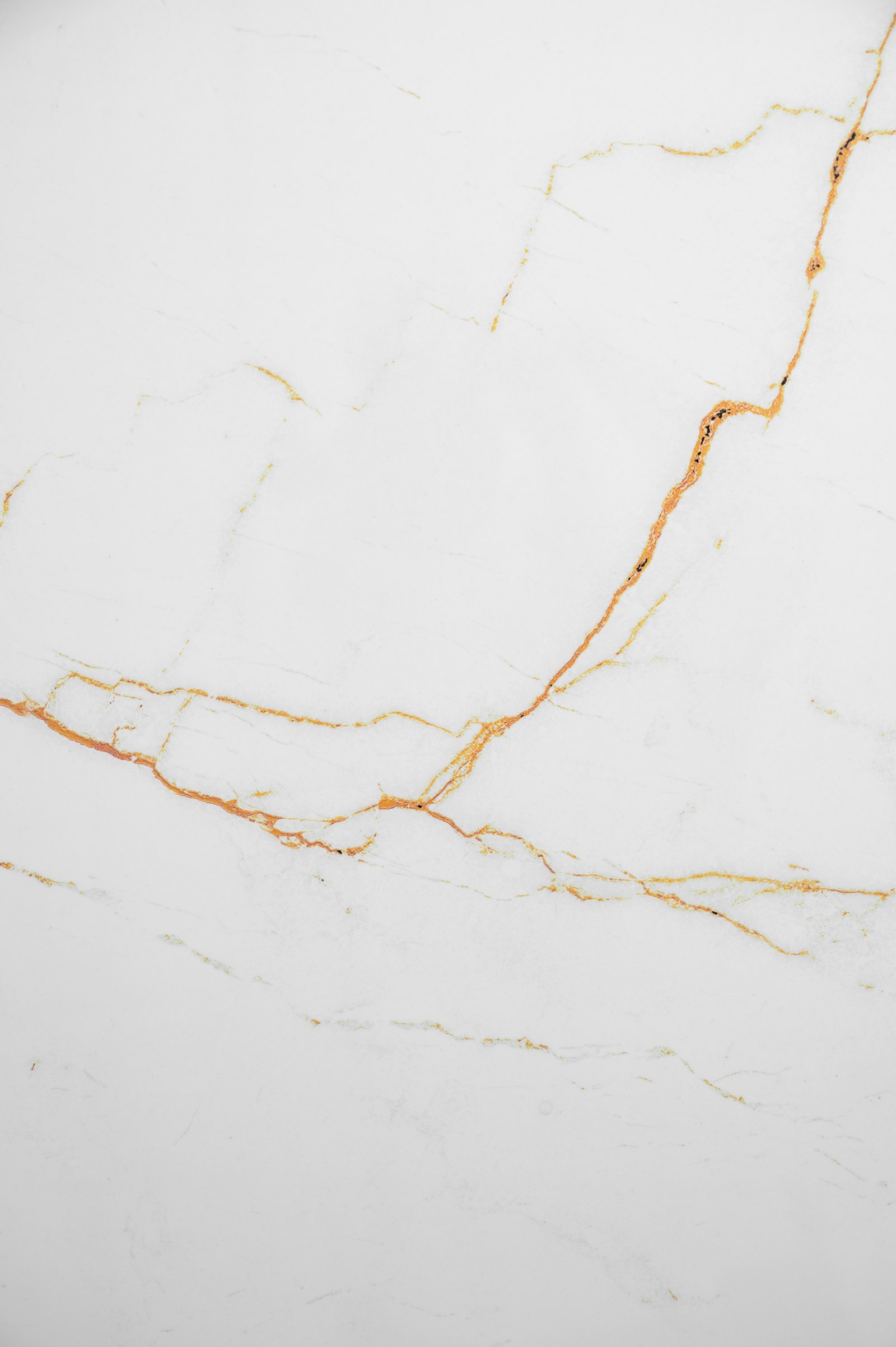 White marble surface with fine golden and brown veining