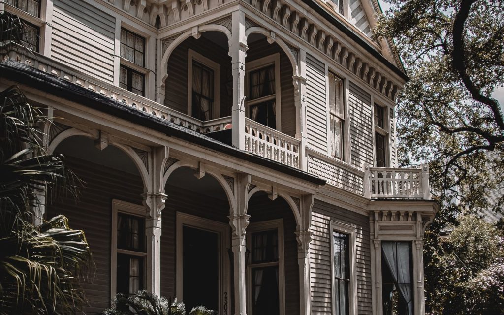 Raised Victorian home in New Orleans with steps up to the front porch