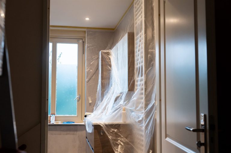 Plastic sheeting hung as a dust barrier during a renovation